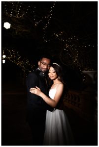 Night bridal portrait of African American couple on the terrace of The Liriodendron Mansion captured by LaTonya Photographer