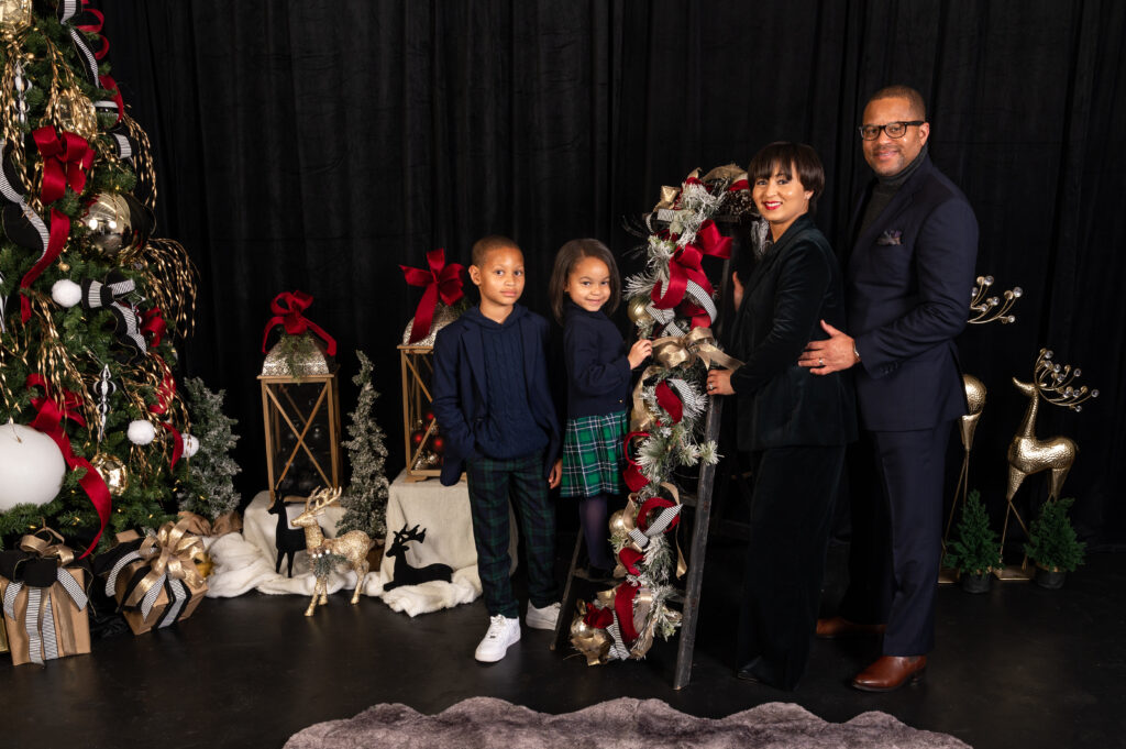 Luxury black, red and gold holiday mini session picture in portrait studio in Alexandria, VA