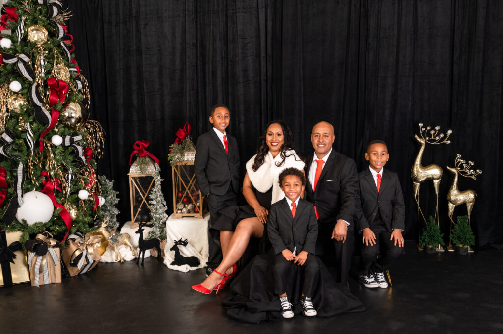 Family of five holiday portrait session dressed in black and red