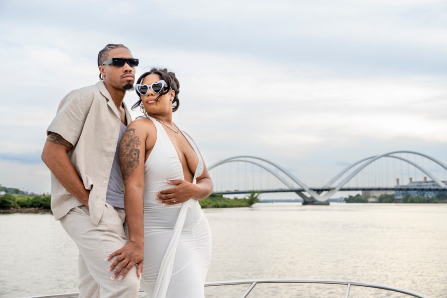 Couple standing on a boat with sunglasses off the Potomac in Washington, DC